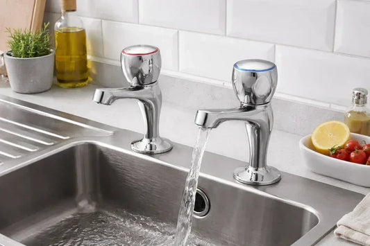 Chrome kitchen sink taps installed, modern design, flowing water, luxury home accents